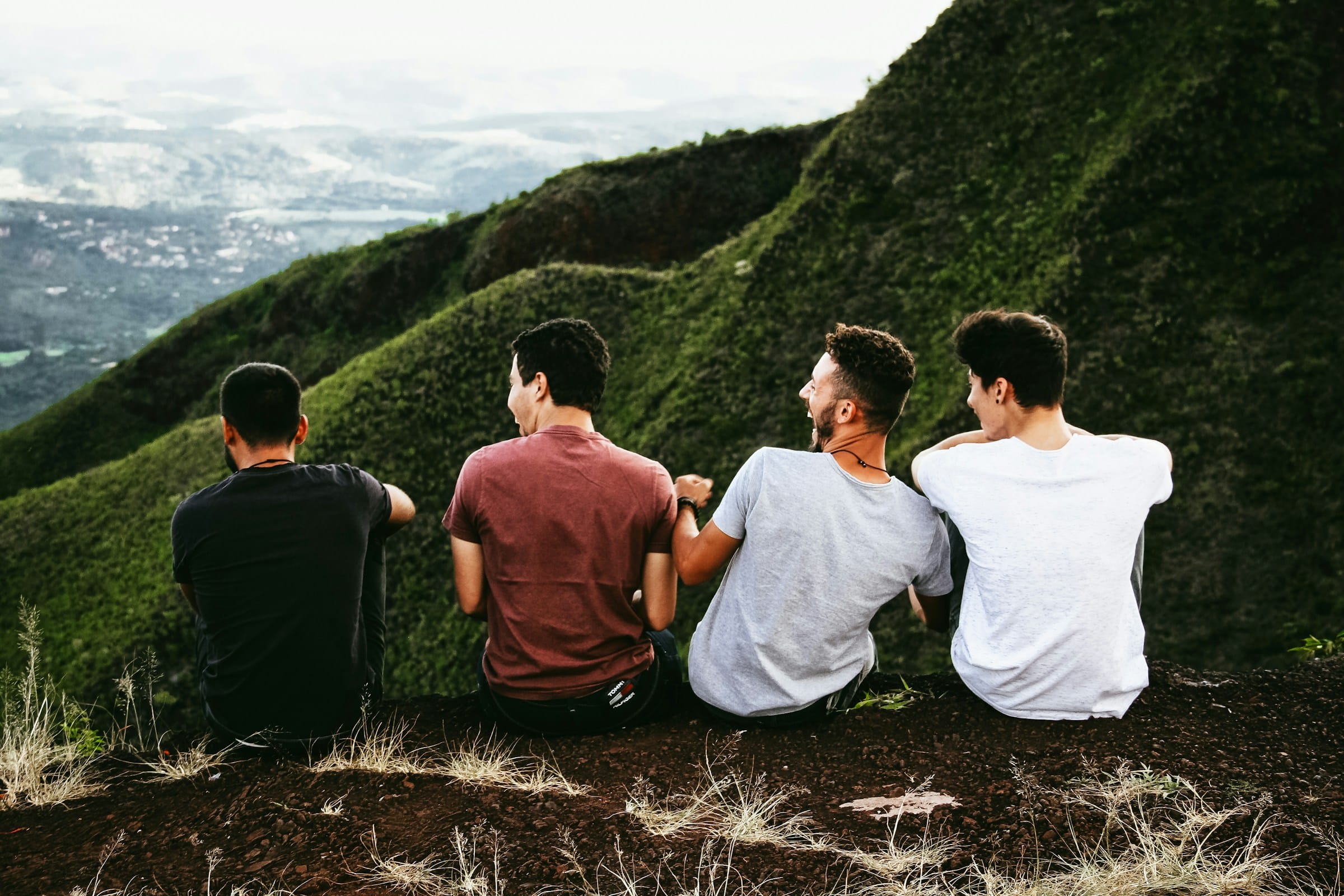 Men laughing on mountainside